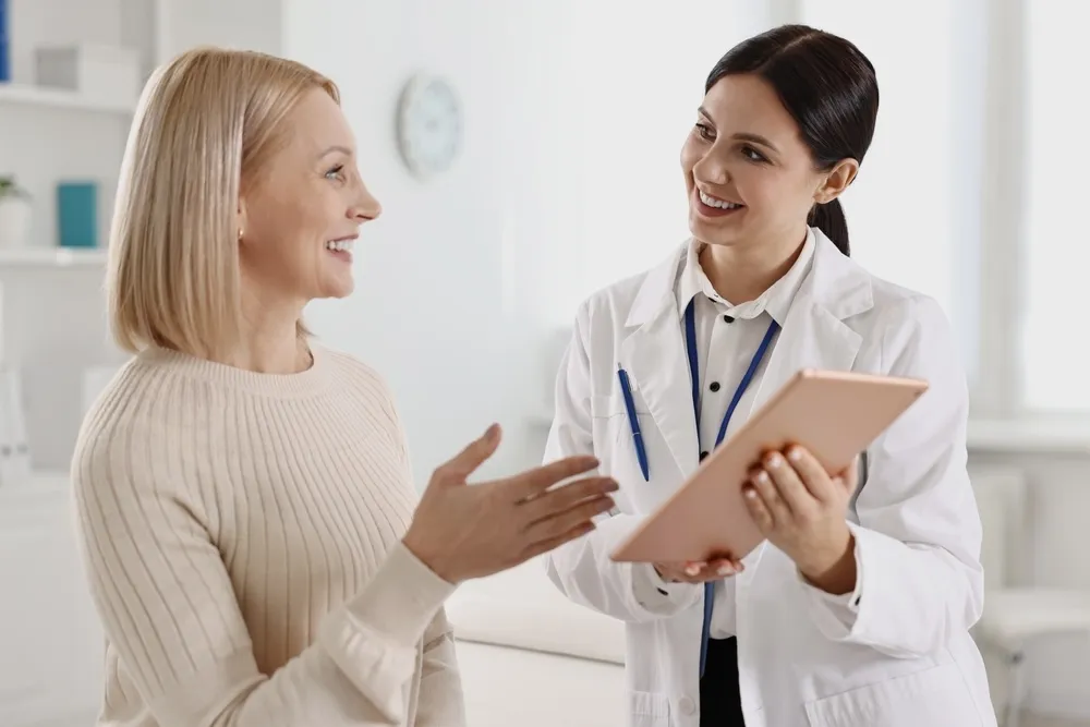 Woman consulting a Fountain Valley gynecologist staff