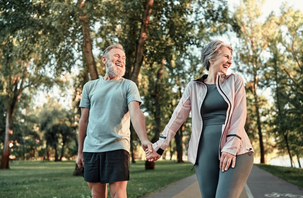 Senior couple smiling after hormone pellet therapy